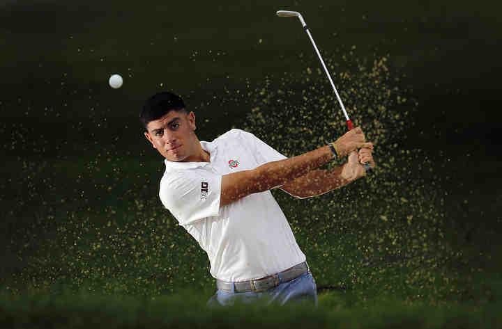 Ohio State's Caleb Ramirez hits out of a bunker at Ohio State golf course on September 11, 2018.  Caleb is the Gameday+ Meet a Buckeye.    (Kyle Robertson / The Columbus Dispatch)